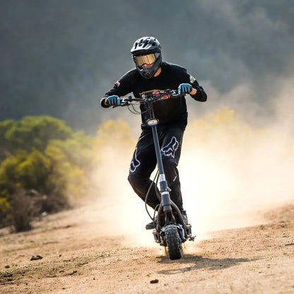 Electric Scooter Nami Burn E 3 Max, a rugged scooter navigating a dusty trail under dynamic riding conditions.