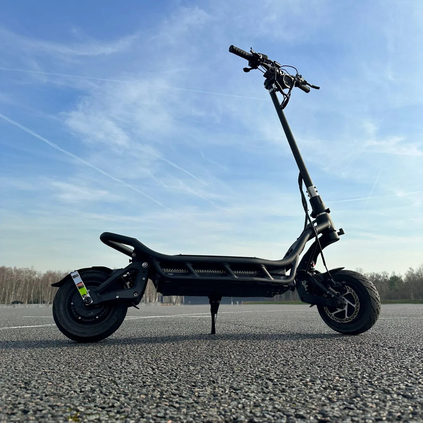 Electric Scooter Nami Burn E 3 Max features a sleek black design with a sturdy frame and large wheels.