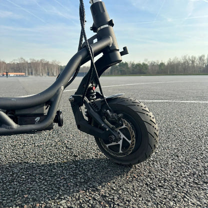 Electric Scooter Nami Burn E 3 Max features a robust front wheel with a stylish rim, designed for durability and performance.