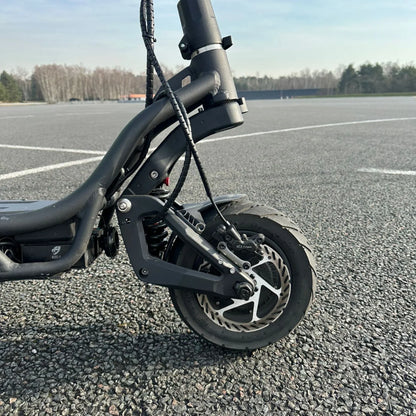 Electric Scooter Nami Burn E 3 Max features a robust front wheel, suspension, and sleek frame design for performance.