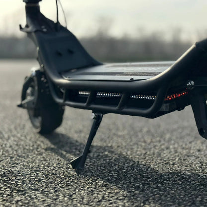 Electric Scooter Nami Burn E 3 Max features a sleek design, elevated footrest, and integrated LED lights for visibility.