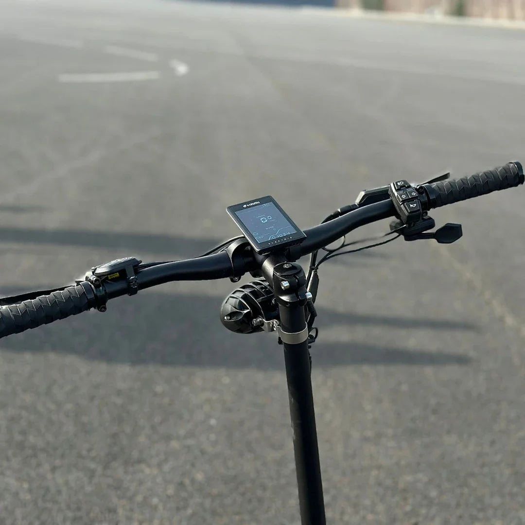 Product title: Electric Scooter Nami Klima. Description: Close-up of the handlebars featuring a digital display and controls for an electric scooter.