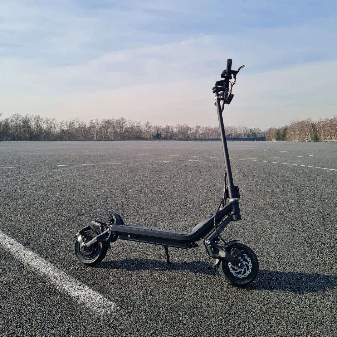 Electric Scooter Nami Klima Max, sleek black design, suitable for outdoor rides on smooth surfaces.