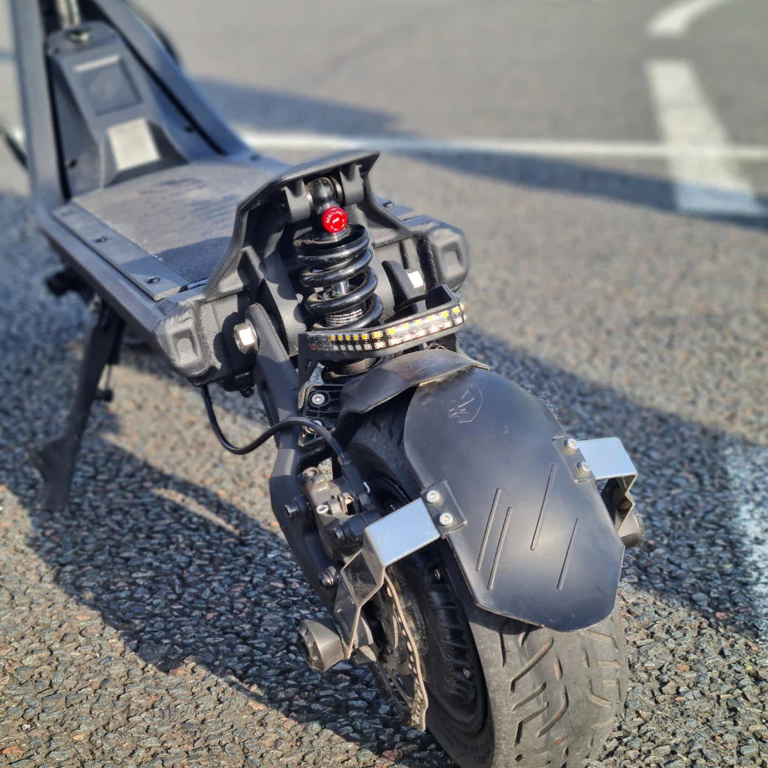 Electric Scooter Nami Klima Max features a robust suspension system and durable rear tire for enhanced stability.