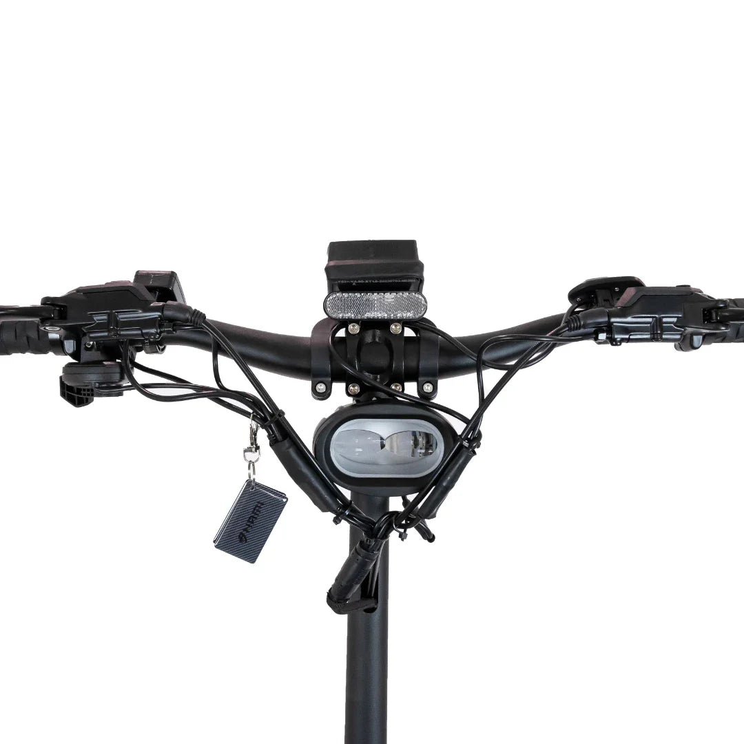 Electric Scooter Nami Klima One features a sleek handlebar setup, displaying controls, a headlight, and wires.