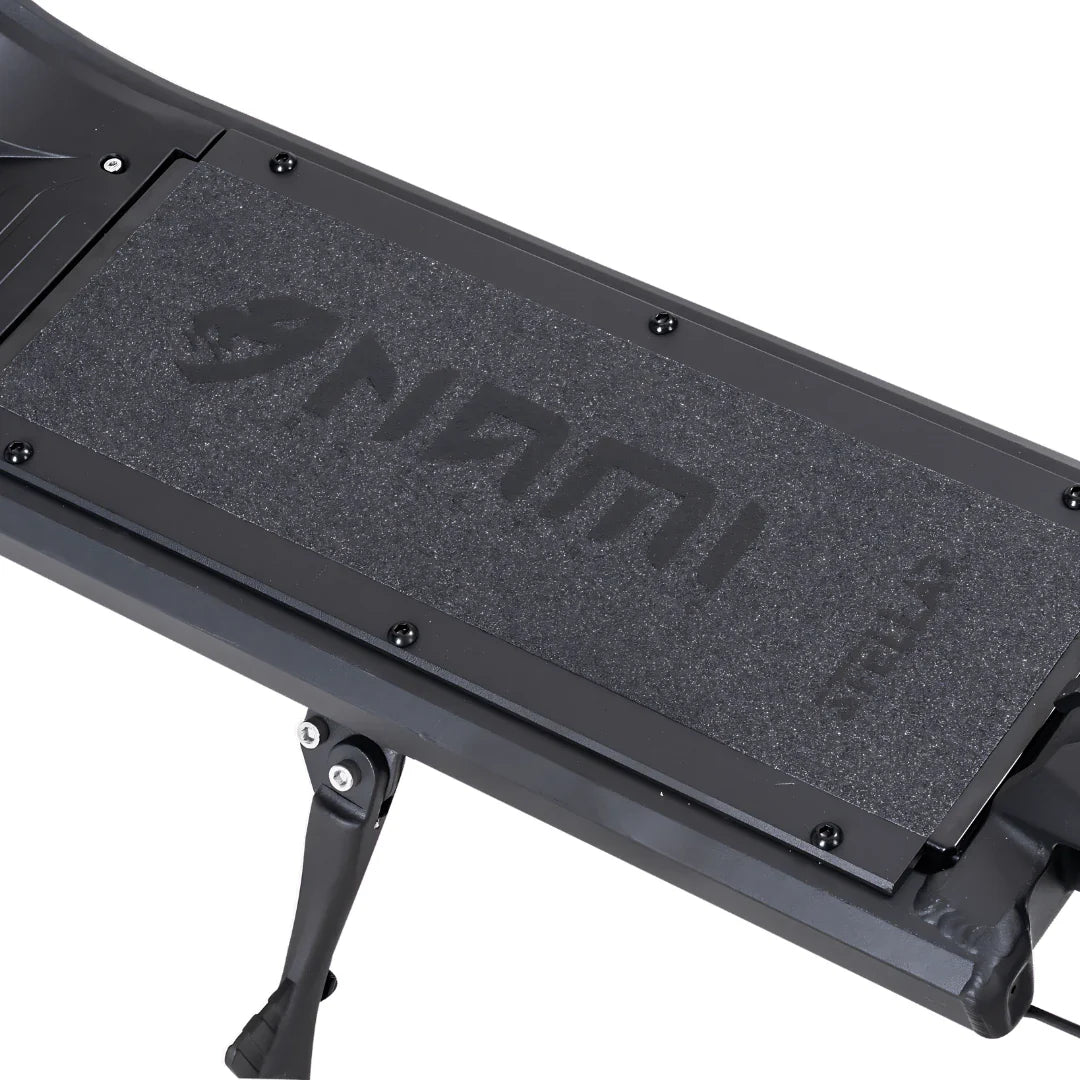 Electric Scooter Nami Stellar features a textured black footpad with the brand logo for enhanced grip.