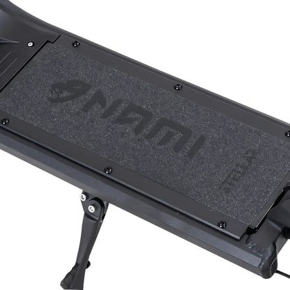 Electric Scooter Nami Stellar features a textured black footpad with the brand logo for enhanced grip.