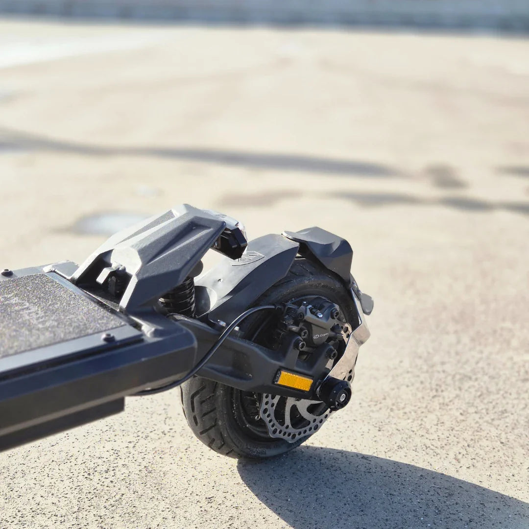 Electric Scooter Nami Stellar features a compact design with a robust rear wheel, suspension, and disc brake.