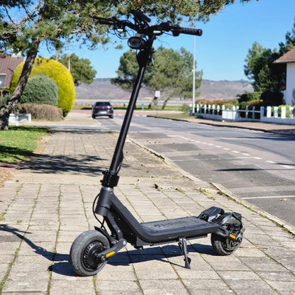 Electric Scooter Nami Superstellar features a sleek black design, robust wheels, and a sturdy frame.