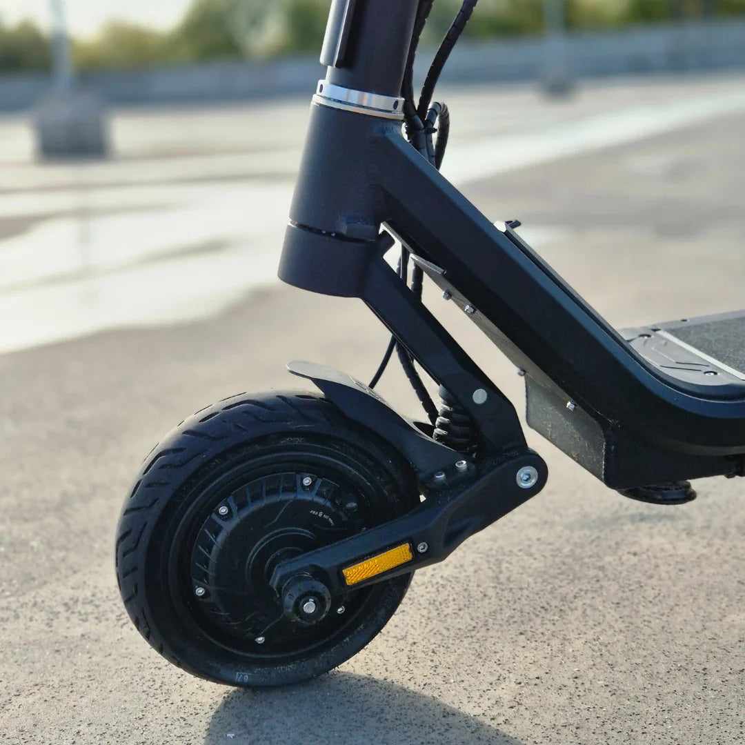 Electric Scooter Nami Superstellar features a robust front wheel with suspension, alloy fork, and dual braking system.