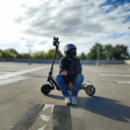 Electric Scooter Nami Superstellar, featuring a sleek design, parked on a smooth surface with a rider in helmet.