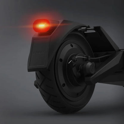 Electric Scooter Navee S40 features a sleek rear wheel design with an illuminated red tail light.