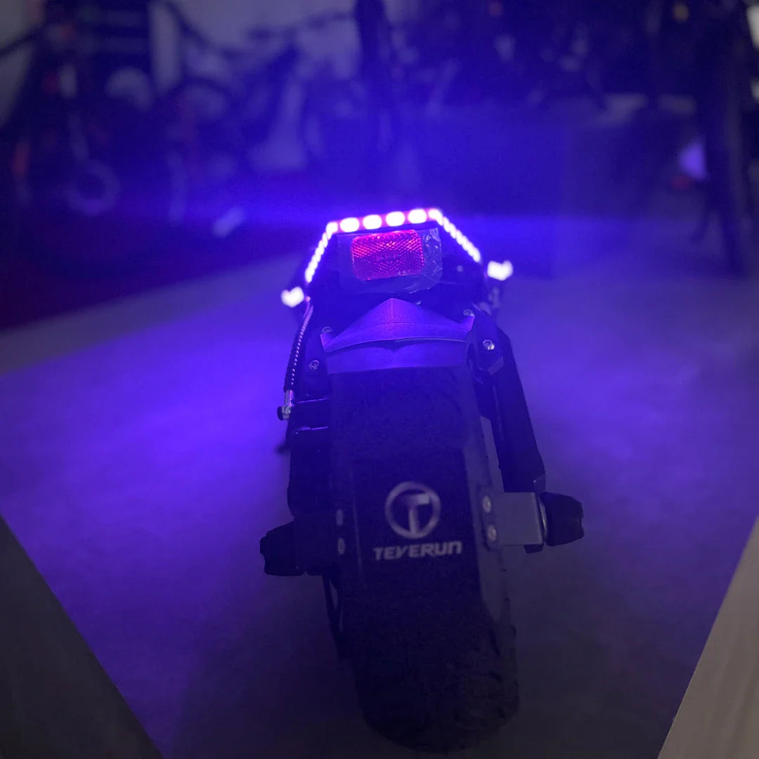 Electric Scooter Teverun Fighter Mini Pro 2025 features a sleek black design, illuminated rear lights, and durable tires.