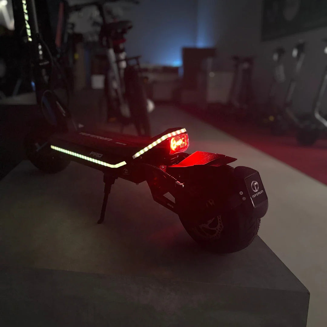 Electric Scooter Teverun Fighter Mini Pro 2025 features a sleek design, reflective lights, and rear brake light.