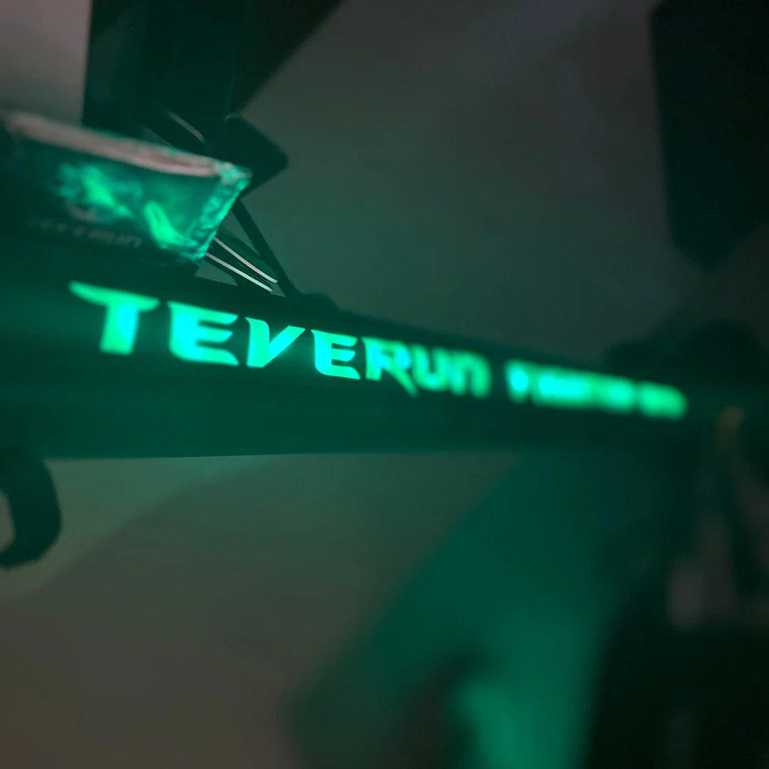 Electric Scooter Teverun Fighter Mini Pro 2025 features a sleek design with illuminated branding for visibility.
