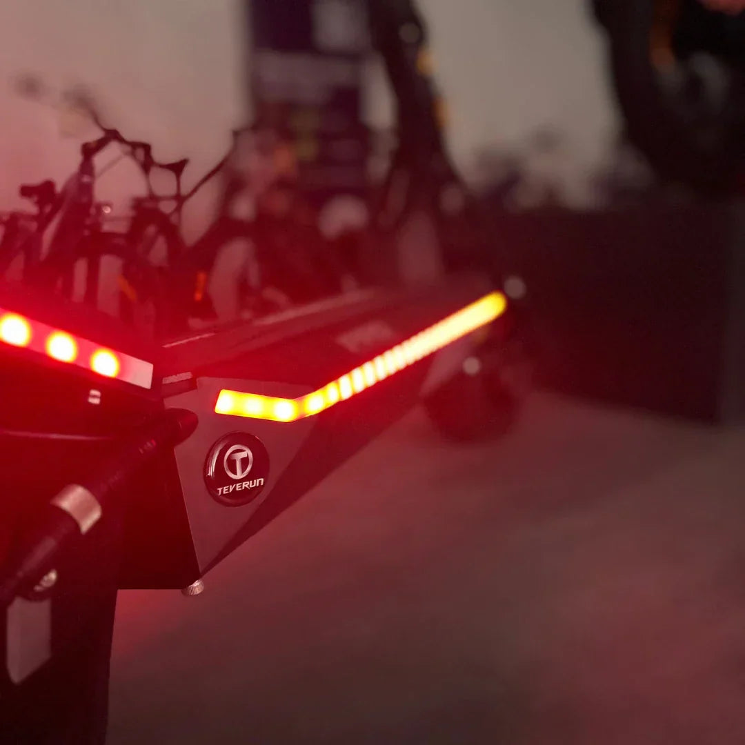 Electric scooter Teverun Fighter Mini PRO 2025 – rear deck and side lights glowing red