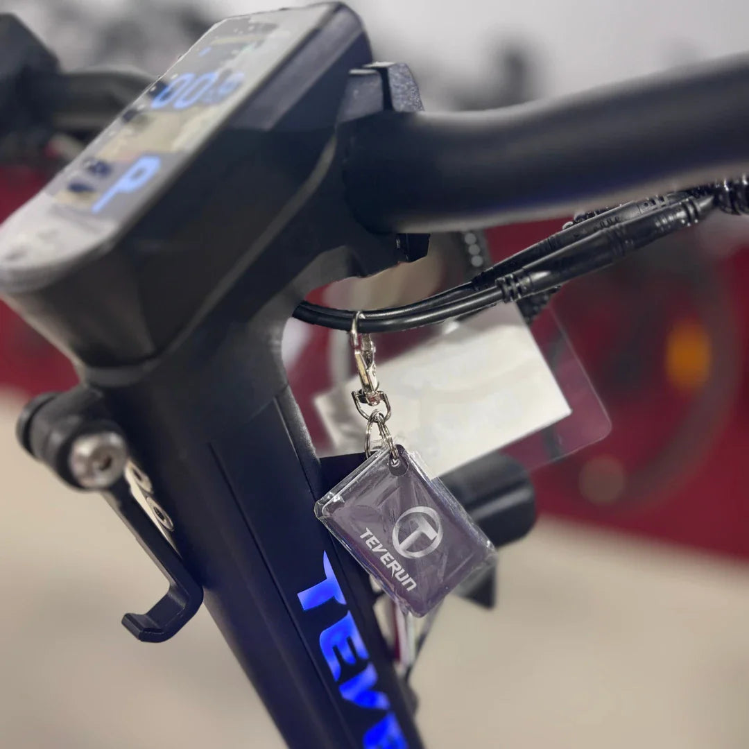 Electric Scooter Teverun Fighter Mini Pro 2025 features a sleek display, illuminated branding, and attached keychain.
