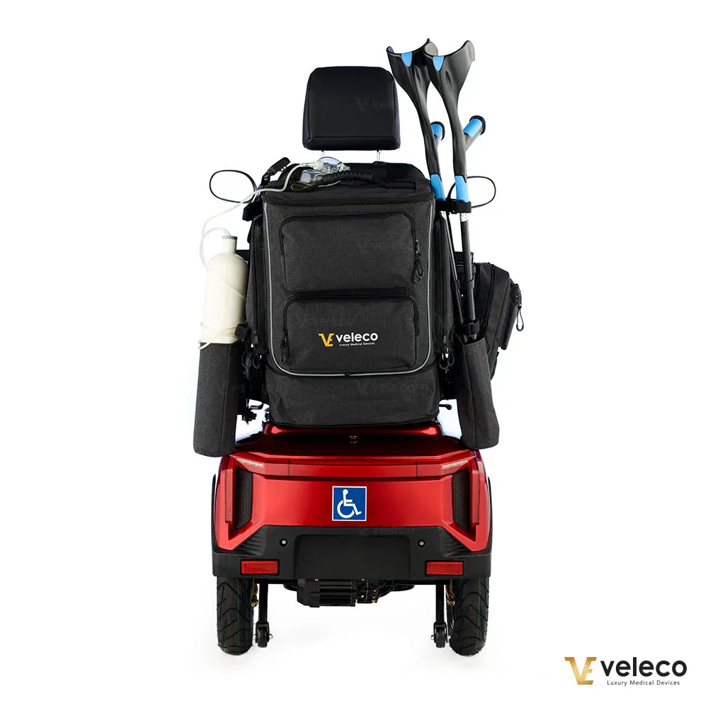 Mobility scooter and wheelchair storage bag – rear view on red scooter with crutches