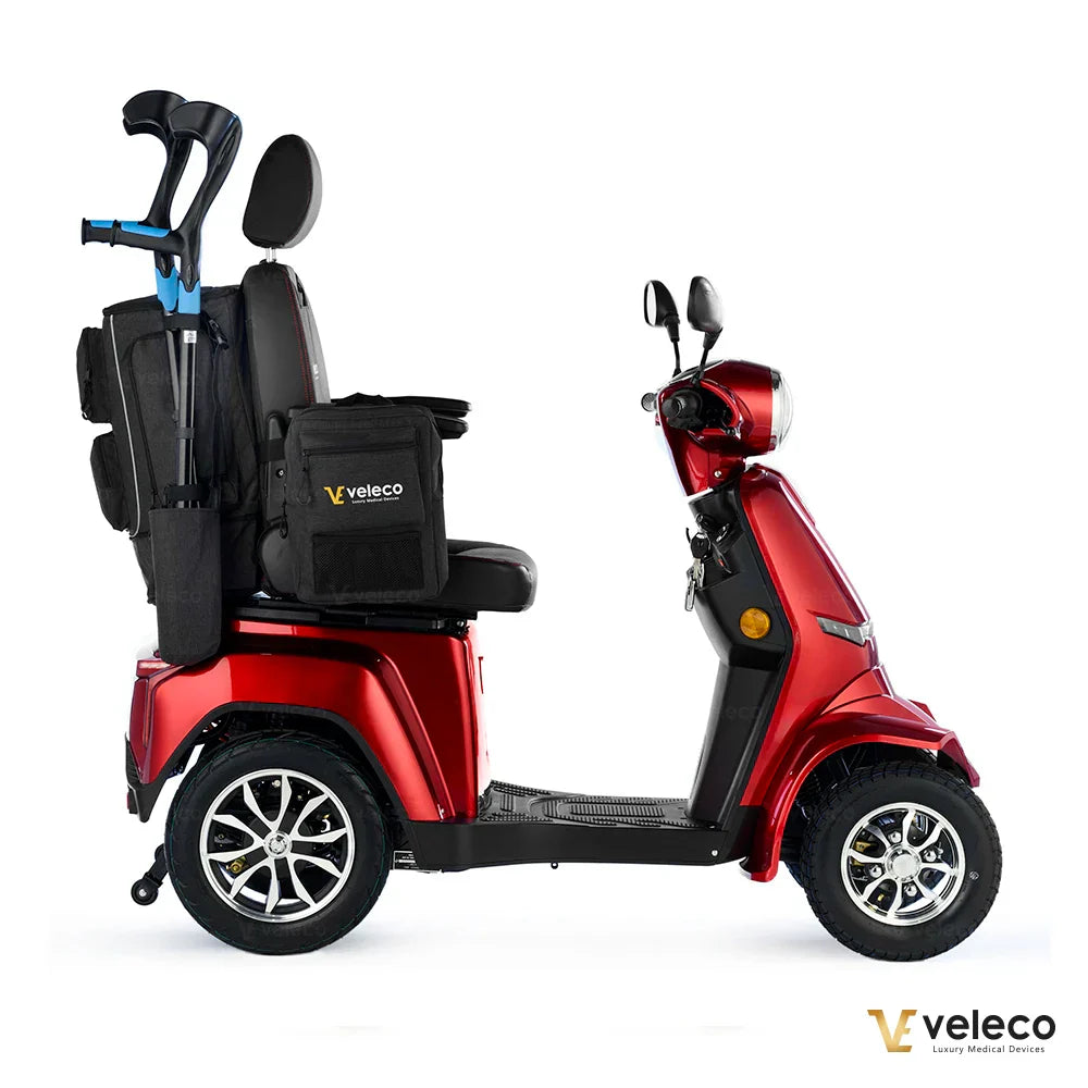 Mobility scooter and wheelchair storage bag – side view on red scooter with crutches
