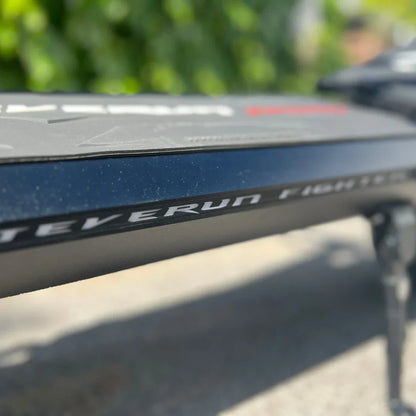Electric Scooter Teverun Fighter 11 Plus features sleek design, showcasing a sturdy frame and logo detail.
