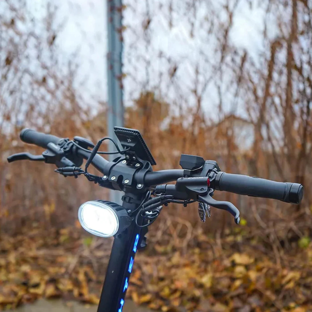 Electric scooter Teverun Fighter 11+ 2024 – handlebar view with headlight outdoors