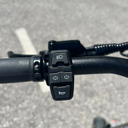 Electric Scooter Teverun Fighter Mini Pro 2025 features handlebar controls for lights, indicators, and horn.