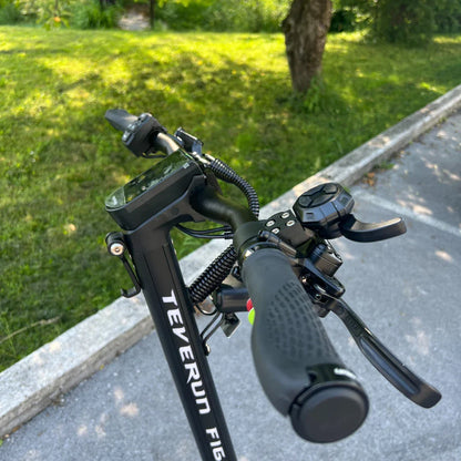 Electric Scooter Teverun Fighter Mini Pro 2025 features a sleek handlebar, digital display, and ergonomic grips.