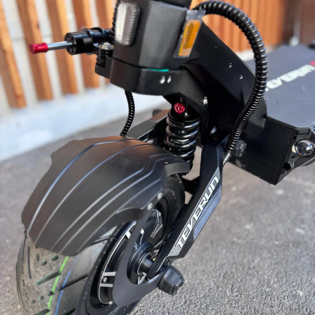 Electric Scooter Teverun Fighter Supreme 7260 Ultra features a robust design, showcasing a durable front wheel, coil spring suspension, and advanced braking system.