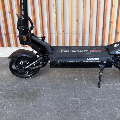 Electric Scooter Teverun Fighter Supreme 7260 Ultra features a sleek black design, robust frame, and large wheels for stability.