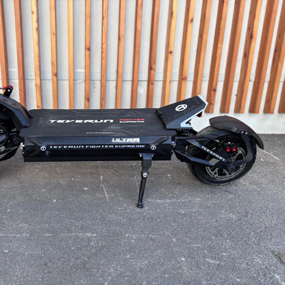 Electric Scooter Teverun Fighter Supreme 7260 Ultra features a sleek black design, sturdy frame, and large wheels.