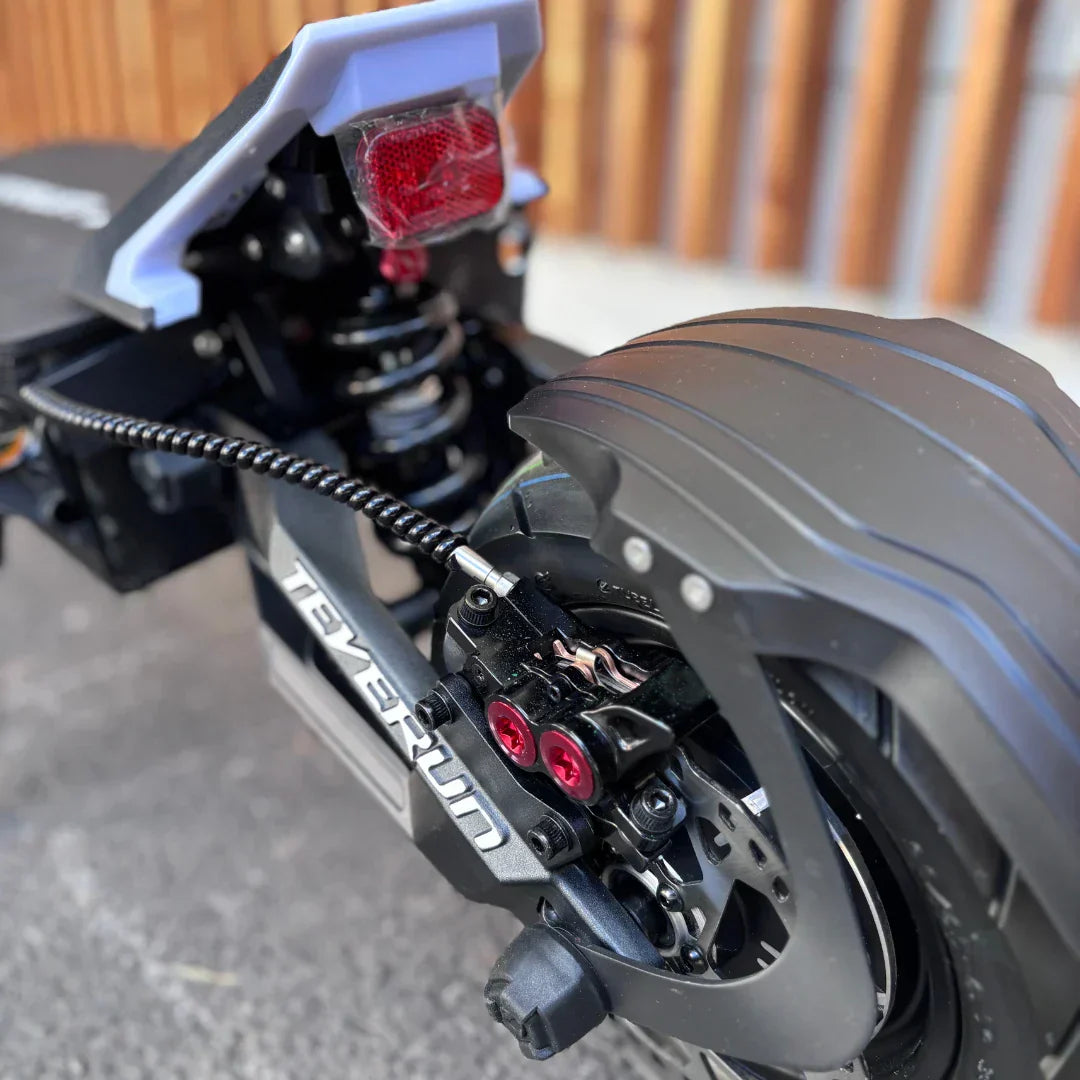 Electric scooter Teverun Fighter SUPREME 7260 Ultra 2026 – rear wheel, brake, and suspension close-up
