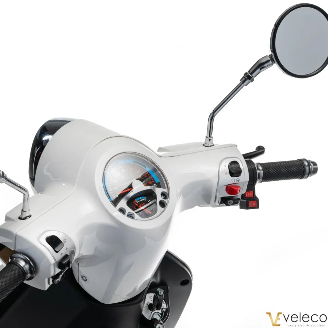 Electric Mobility Scooter Veleco Cristal features a sleek white dashboard with controls and mirror.
