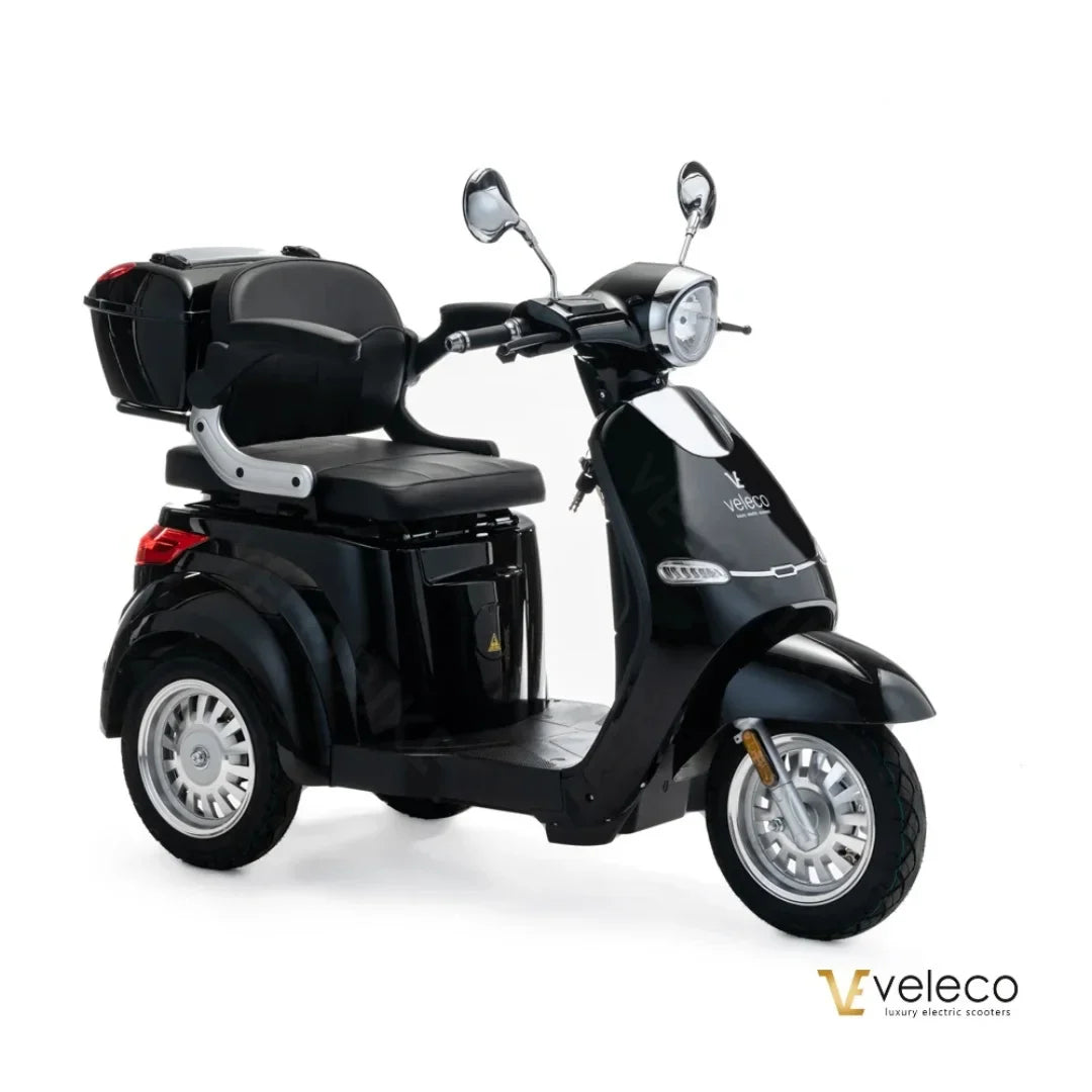 Electric Mobility Scooter Veleco Cristal features a stylish black design, comfortable seating, and spacious storage.