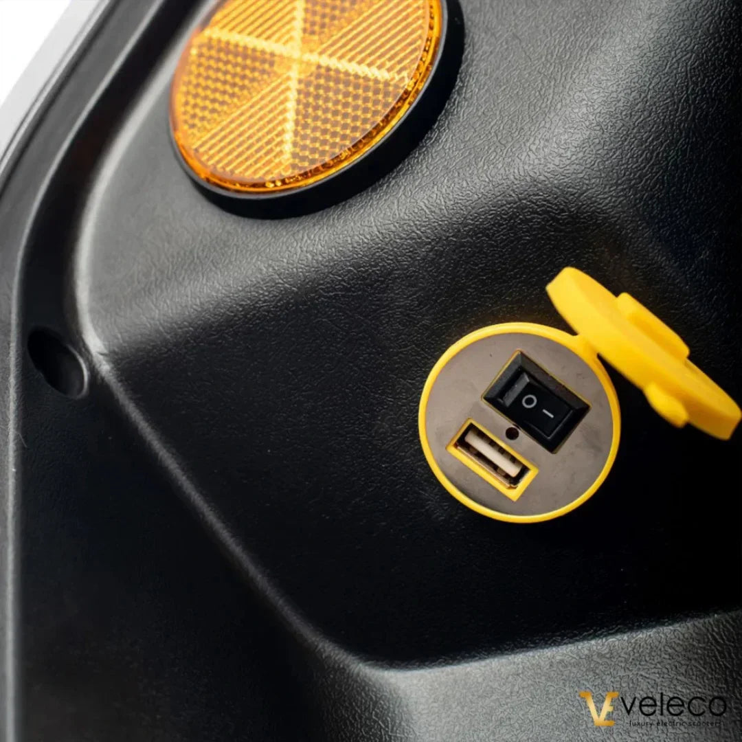 Veleco Faster – uSB charging port and reflector close-up