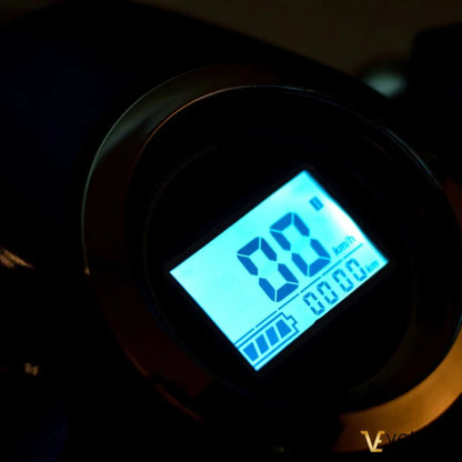 Electric Mobility Scooter Veleco Faster features a digital display showing speed and battery level.