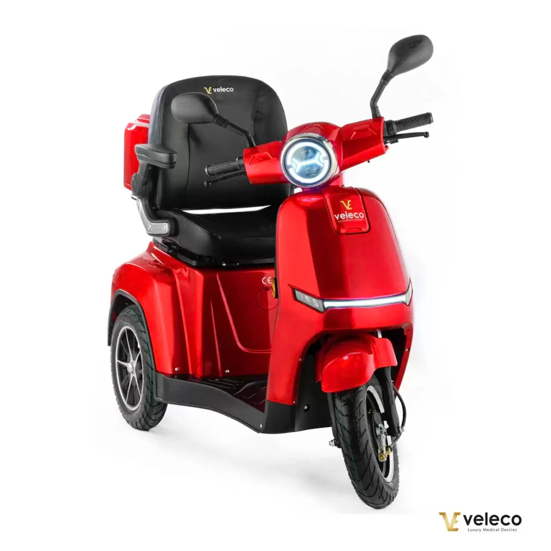 Electric Mobility Scooter Veleco Turris, sleek red design, comfortable seat, headlights and durable tires.