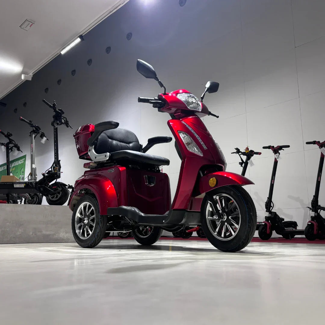 Vigorous VISTA 1 – red colour variant in showroom, front three-quarter