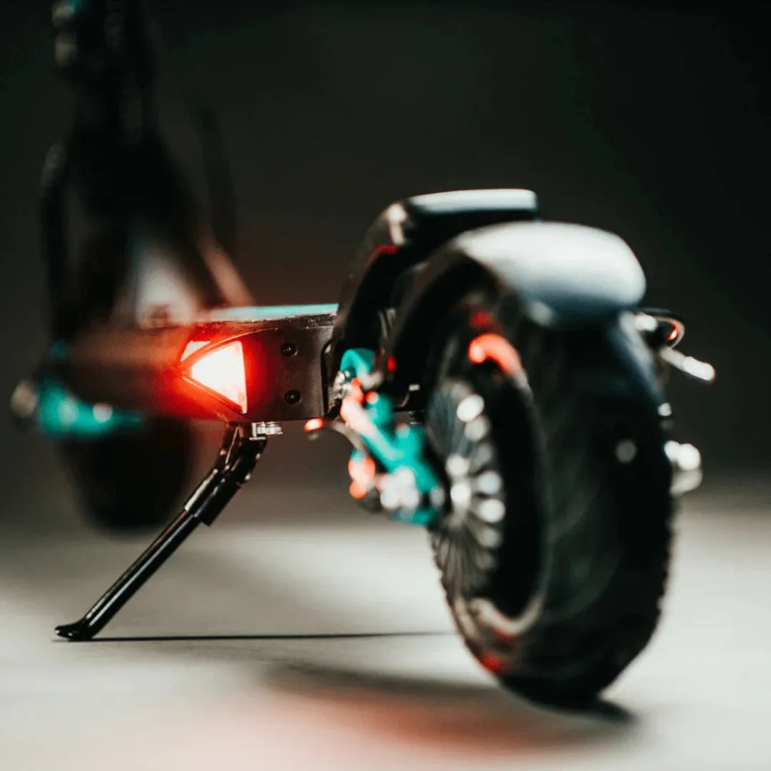 Electric Scooter Vsett 9 features a stylish design, vibrant rear lights, and a sturdy kickstand for convenience.