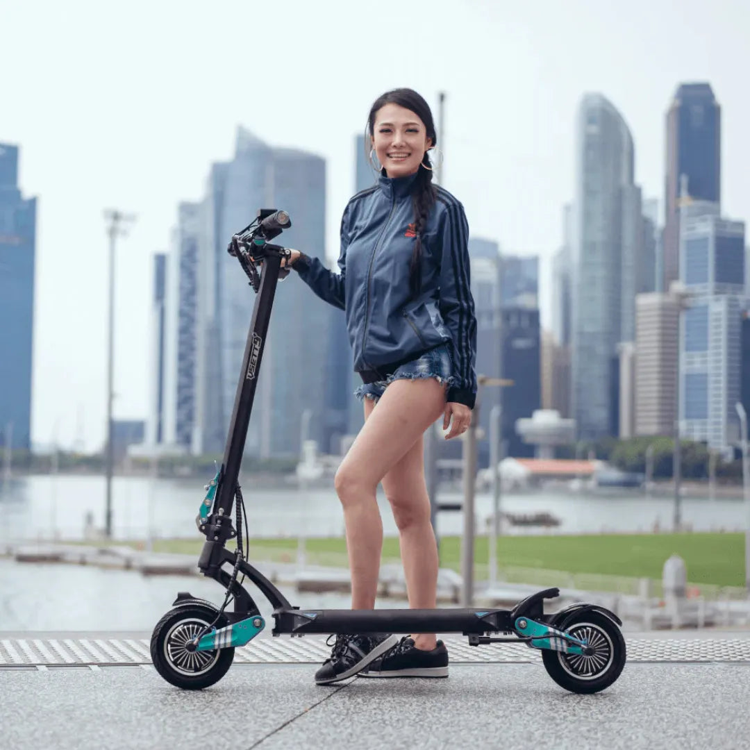 Electric scooter VSETT 9+ – woman standing with, outdoor setting