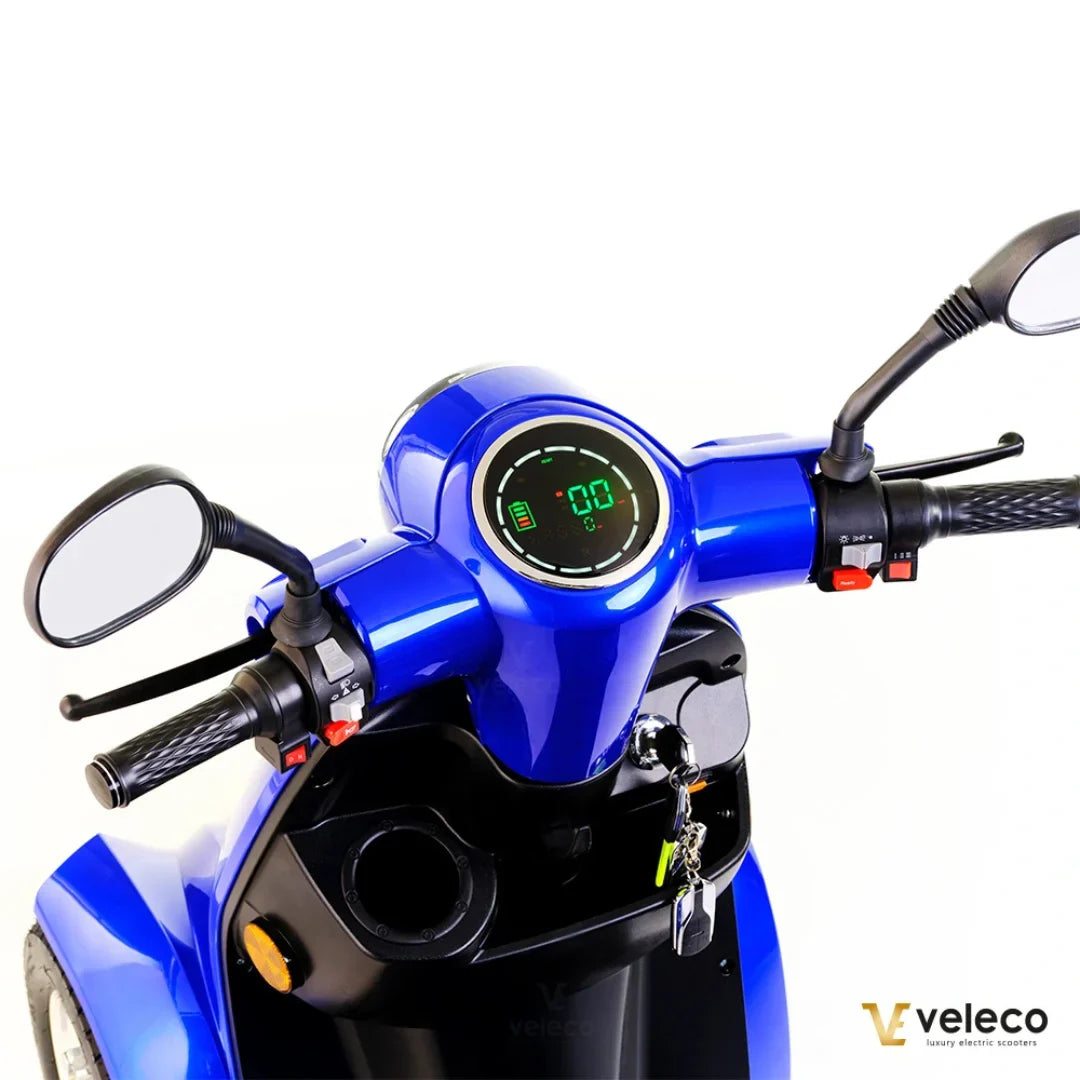 Electric Mobility Scooter Veleco Gravis features a sleek blue design, digital display, and ergonomic handlebars.