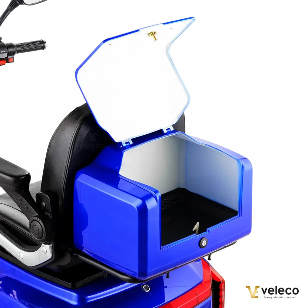 Electric Mobility Scooter Veleco Gravis features a spacious blue storage compartment, ideal for personal items.