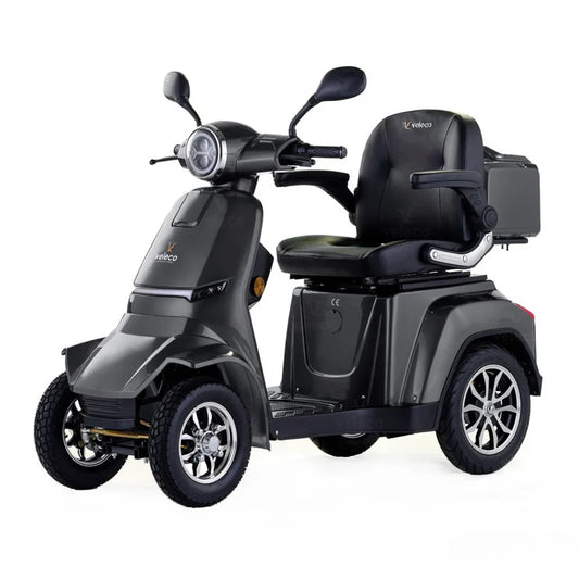Electric Mobility Scooter Veleco Gravis features a sleek gray design, comfortable seat, and sturdy wheels for stability.