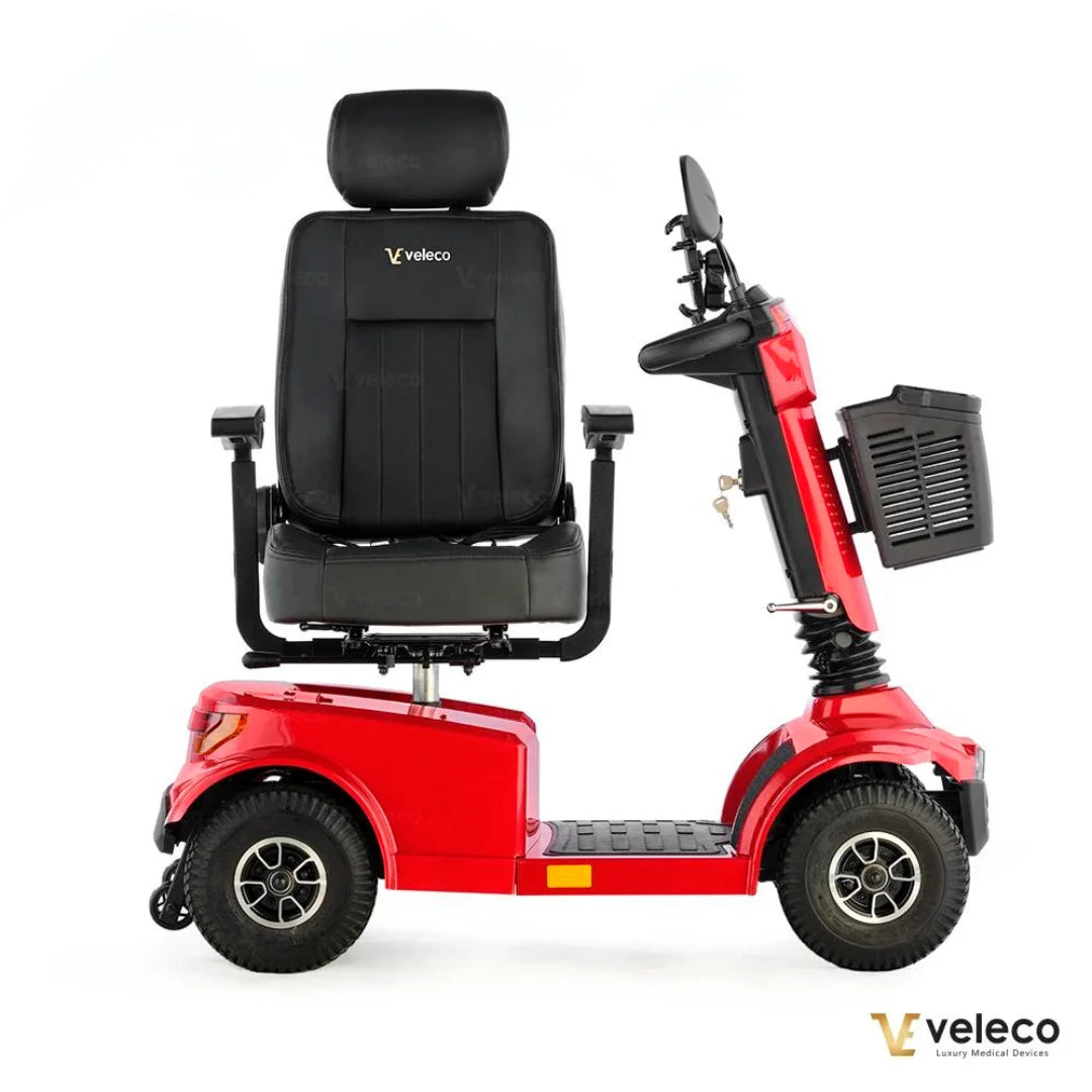 Electric Mobility Scooter Veleco Jumpy features a vibrant red body, comfortable black seat, and sturdy wheels.
