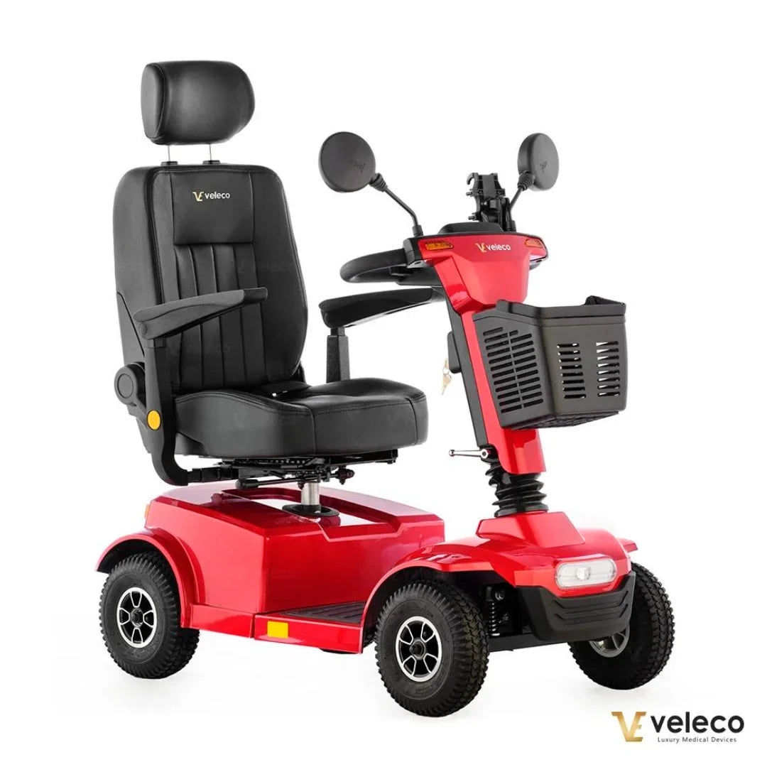 Electric Mobility Scooter Veleco Jumpy, sleek red design, comfortable black seat, sturdy wheels, includes front basket.