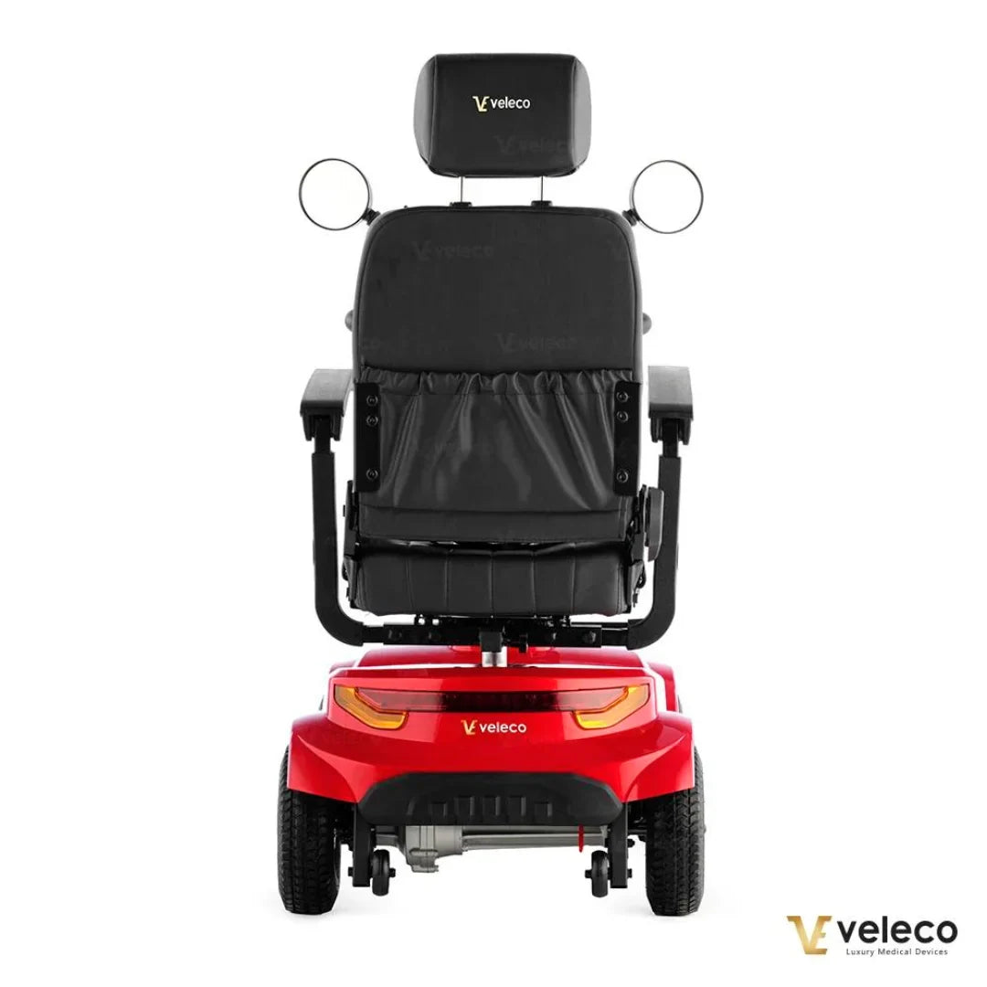 Electric Mobility Scooter Veleco Jumpy features a sleek red design, comfortable black seat, and safety mirrors.