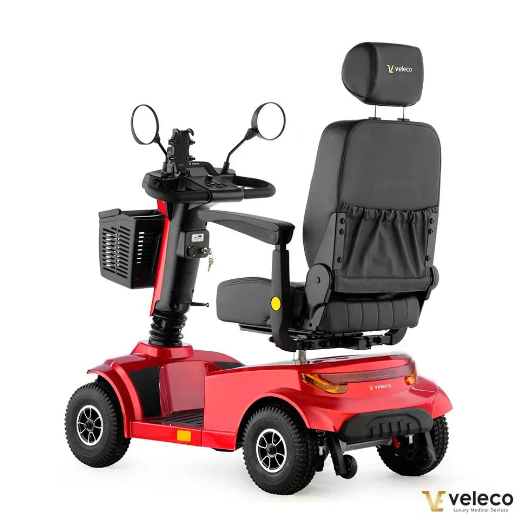 Electric Mobility Scooter Veleco Jumpy, a stylish red scooter with a comfortable seat and storage basket.