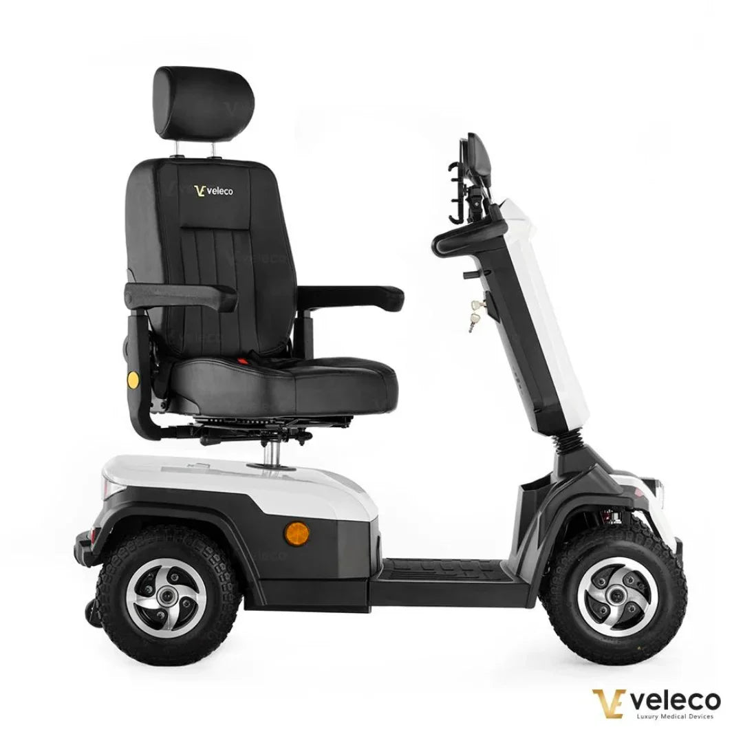 Electric Mobility Scooter Veleco Sharpy features a comfortable black leather seat, sturdy wheels, and a sleek design.