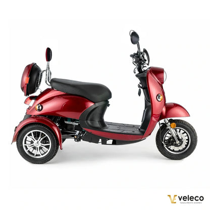 Electric Mobility Scooter Veleco Zt63 features a stylish red design, comfortable seat, three wheels, and mirrors.