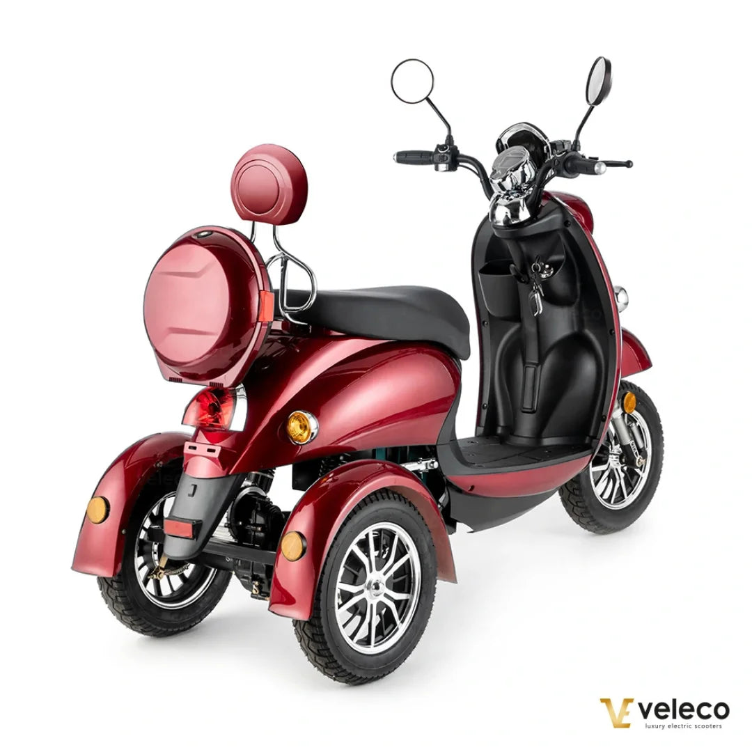 Electric Mobility Scooter Veleco Zt63 features a sleek red design, comfortable seating, and three sturdy wheels.
