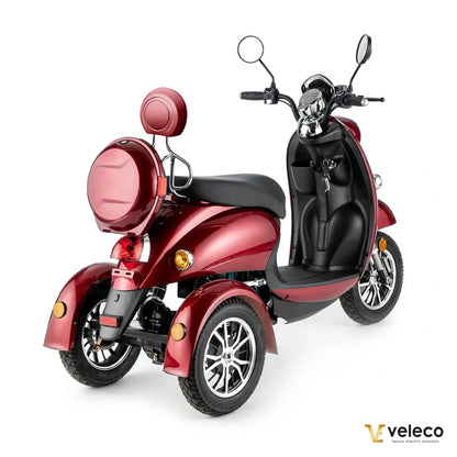 Electric Mobility Scooter Veleco Zt63 features a sleek red design, comfortable seating, and three sturdy wheels.